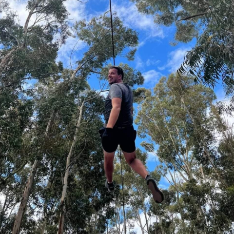 Client enjoying a thrilling ride on the Big Zip at Acrobranch Casalinga